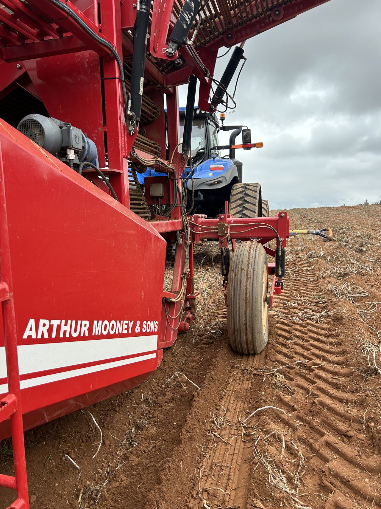 Arthur Mooney & Sons on side of harvester